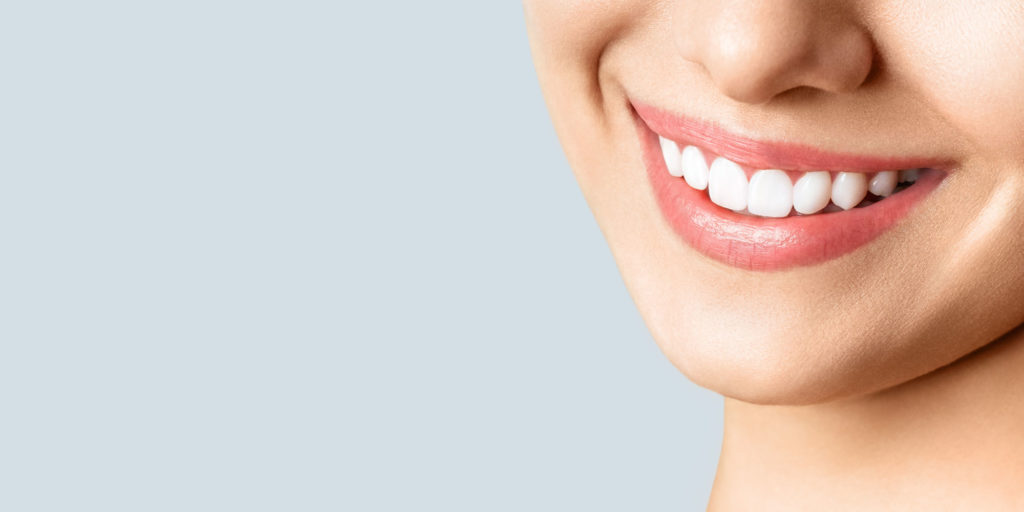 dental patient smiling after gum recession procedure