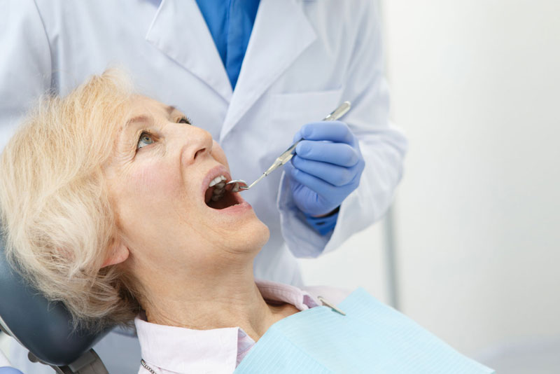 dental patient undergoing gingivectomy procedure
