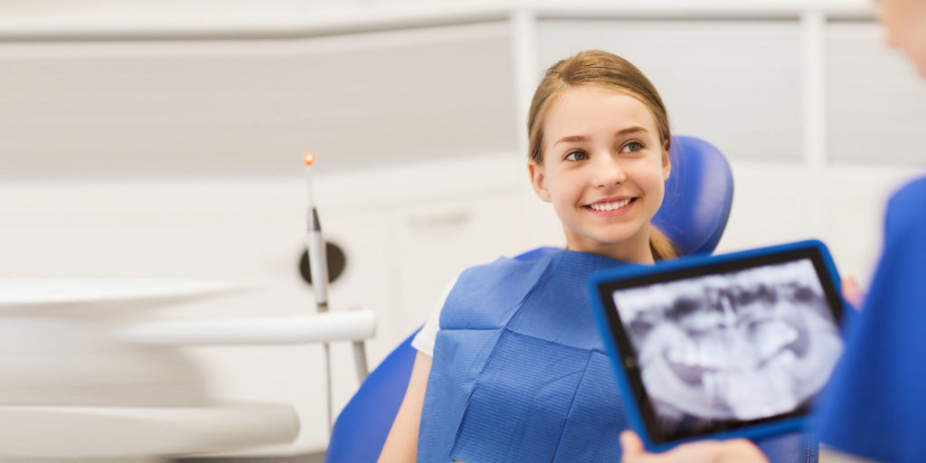 dentist discussing dental procedure with patient